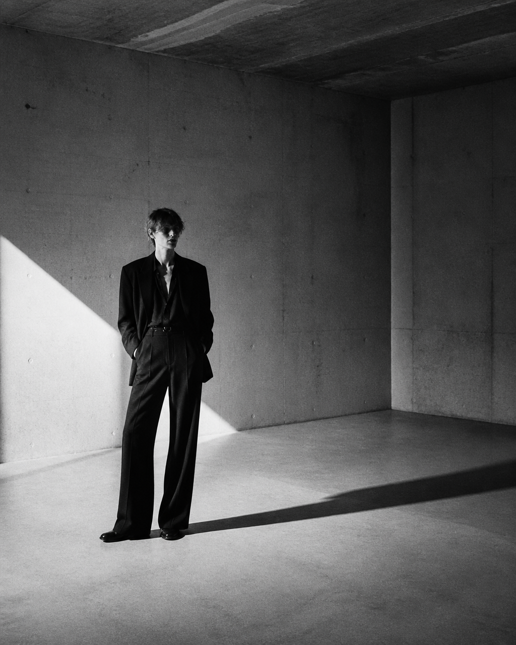 Editorial figure in concrete interior