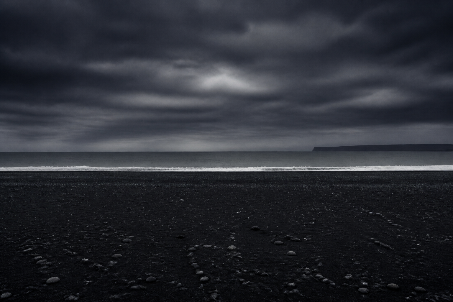 Dark seascape under heavy clouds.